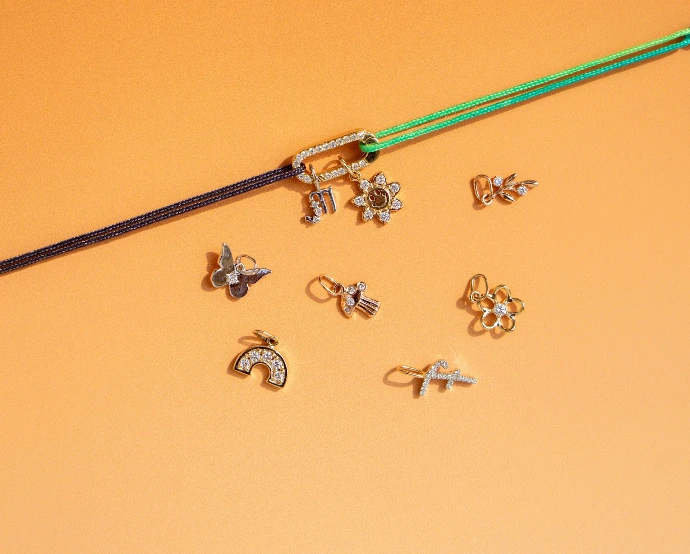 A pair of scissors next to a bunch of earrings