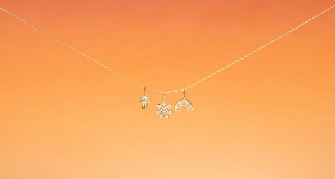 A couple of necklaces hanging from a string